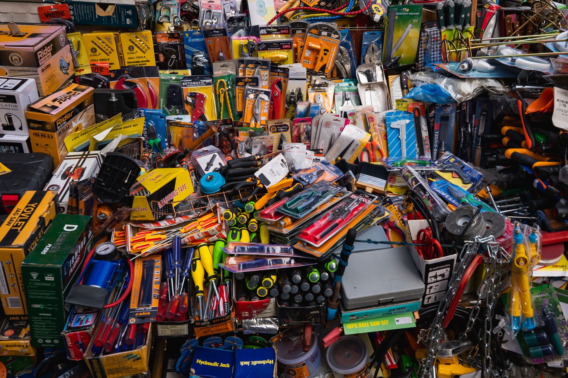A vibrant display of various tools and hardware items at a market in Colombo, Sri Lanka.