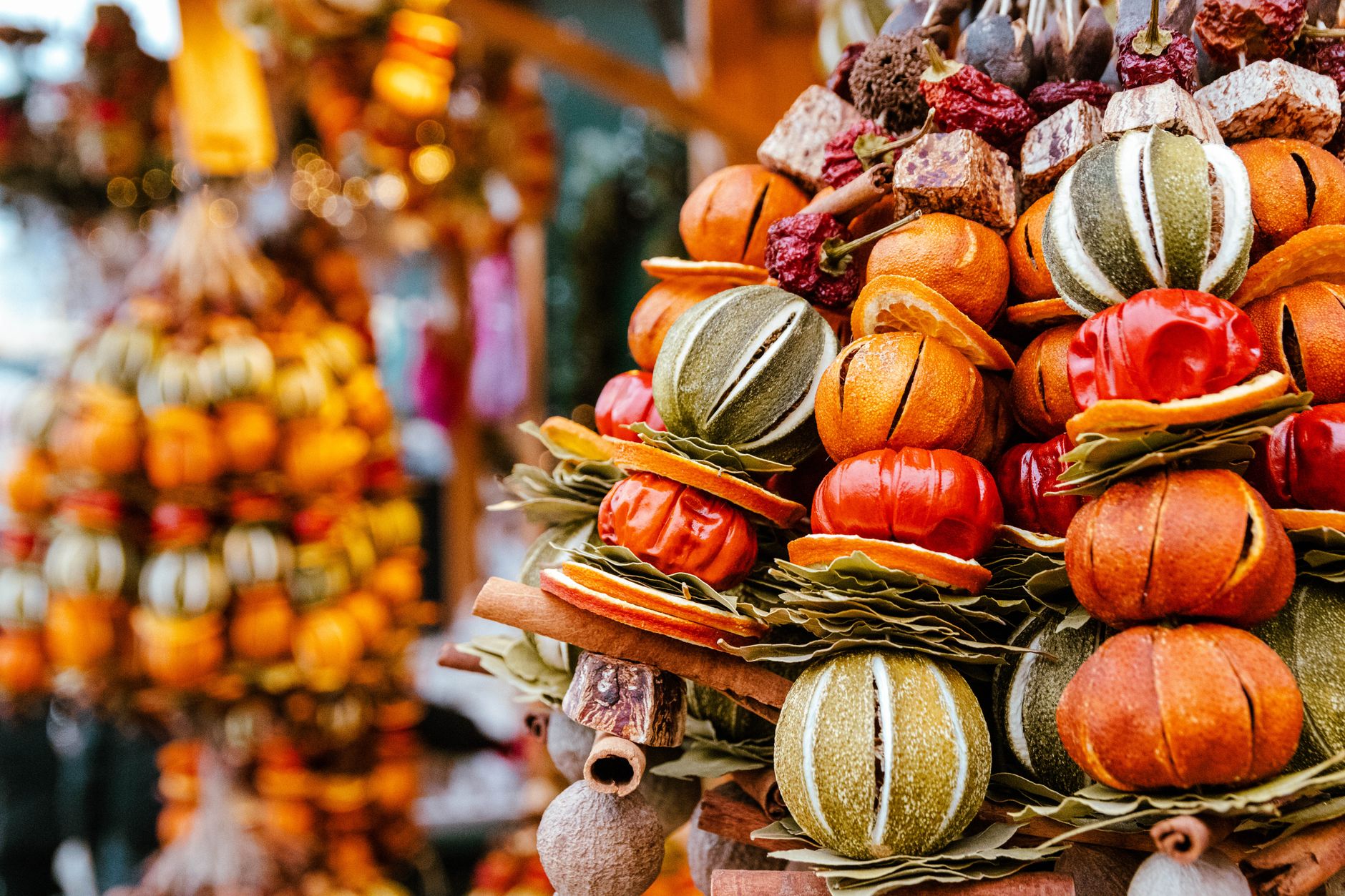 Colorful dried fruit and ornament display at a Vienna market in autumn.