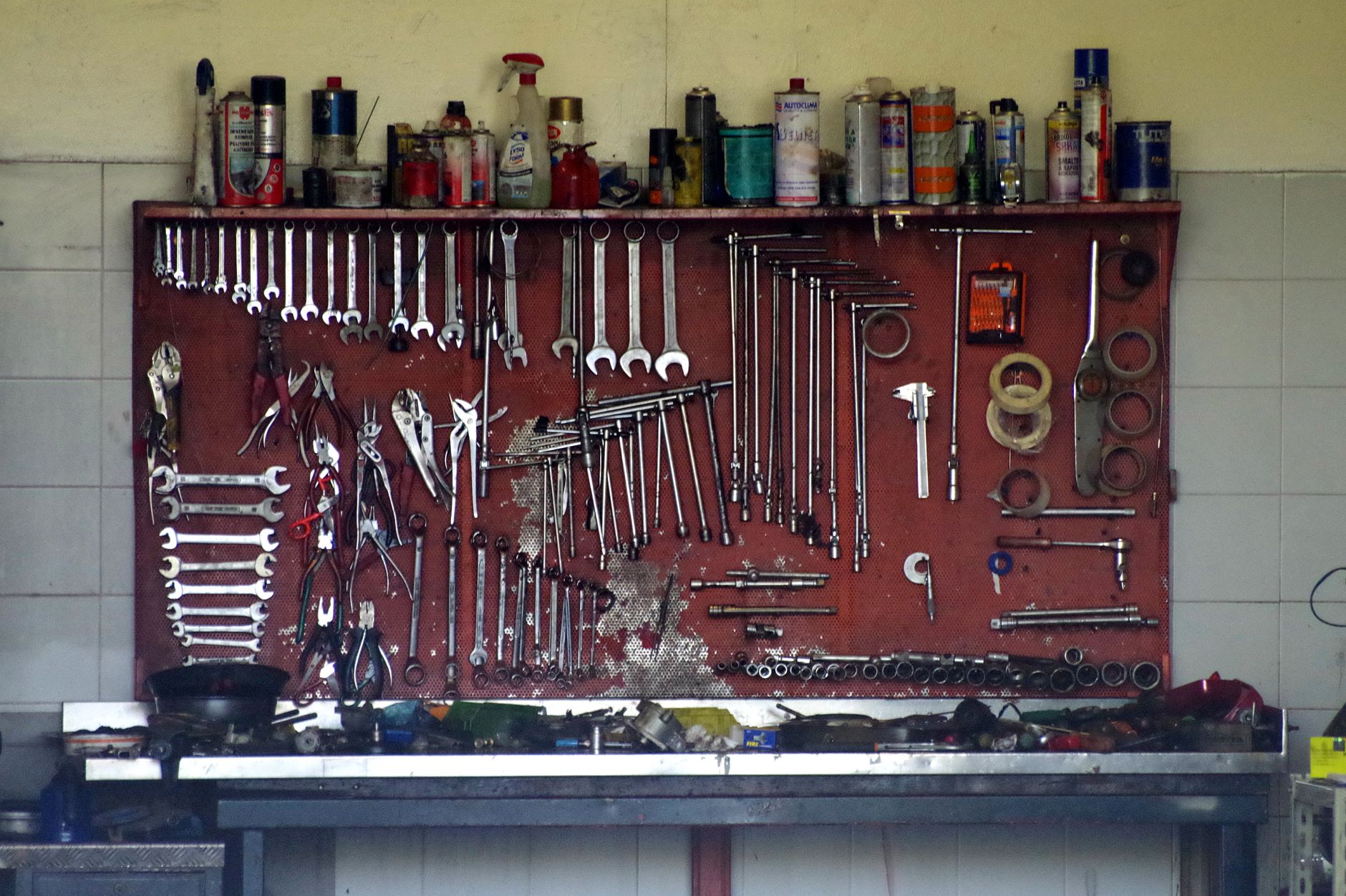 A neatly organized set of workshop tools on a pegboard, perfect for mechanic or DIY use.